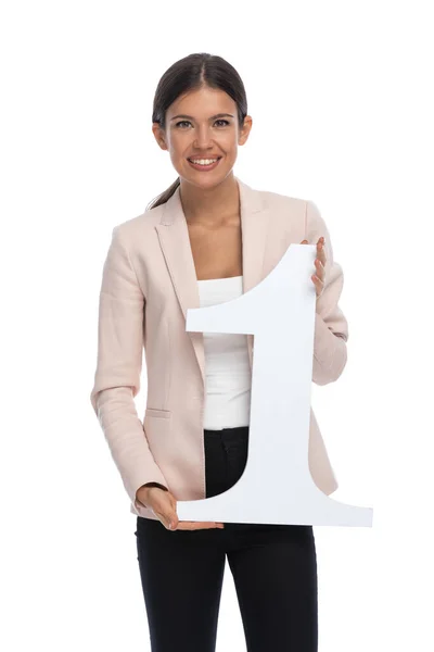 Happy Businesswoman Pink Jacket Holding Presenting Number One Sign Smiling — Stock Photo, Image