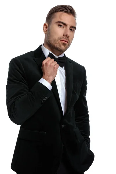 Confident Elegant Guy Black Tuxedo Holding Hand Pocket Adjusting Bowtie — Stock Photo, Image