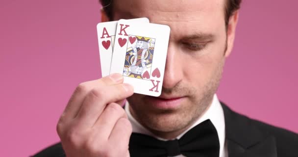 Happy Elegant Groom Black Tuxedo Covering Eye Cards Playing Confidently — Stock Video