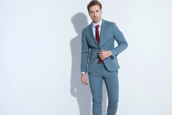 Confident Young Guy Buttoning Fixing Blue Elegant Suit While Walking — Stock Photo, Image