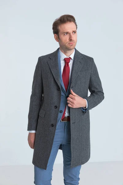 Attractive Businessman Adjusting His Coat Looking Away Fashion Pose — Stock Photo, Image