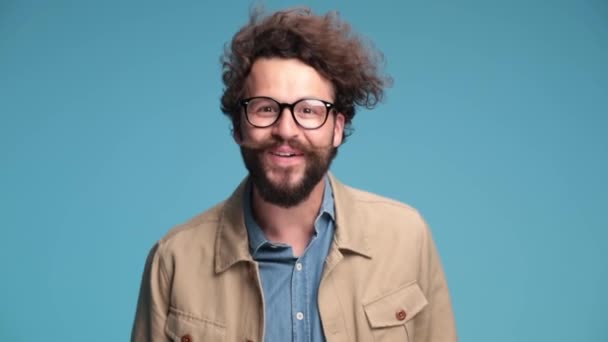 Happy Curly Hair Man Denim Shirt Eyeglasses Having Fun Waving — Stock Video