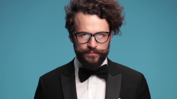 Curly Hair Guy Elegant Tuxedo Glasses Adjusting Fixing Moustache Winking — Vídeo de Stock