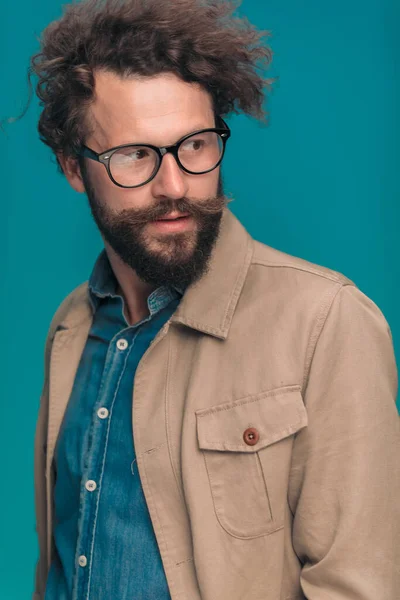 Attractive Bearded Guy Eyeglasses Wearing Denim Shirt Looking Side While — Stock Photo, Image