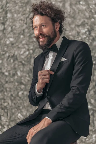 Portrait Excited Young Groom Holding Hand Jacket Fixing Tuxedo While — Stock Photo, Image