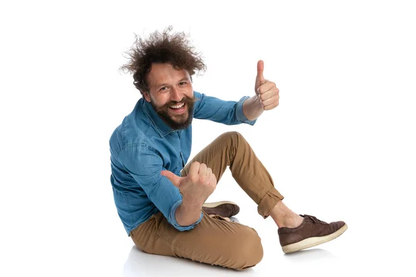 Casual Man Sitting Ground Giving Thumbs Both Hands White Background — Stock Photo, Image