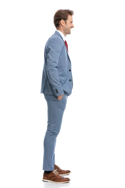 Side View Young Man Blue Suit Holding Hands Pockets Smiling — Stock Photo, Image