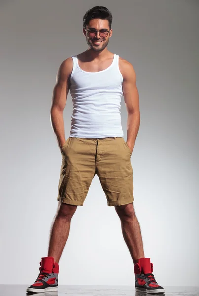 Man in undershirt and shorts smiling — Stock Photo, Image