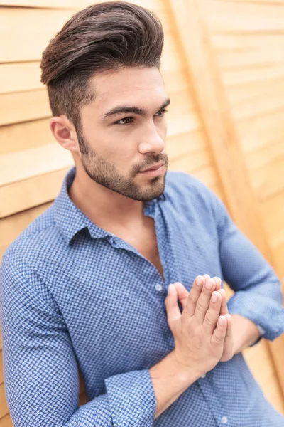 Young casual man is praying — Stock Photo, Image