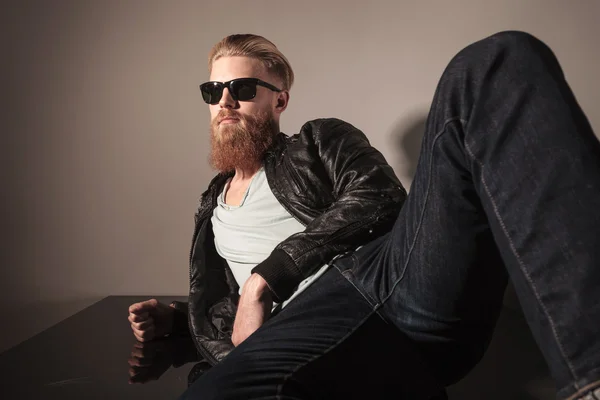 Angle view of a male model sitting — Stock Photo, Image