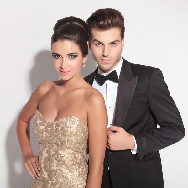 Elegant couple posing together on studio background — Stock Photo, Image