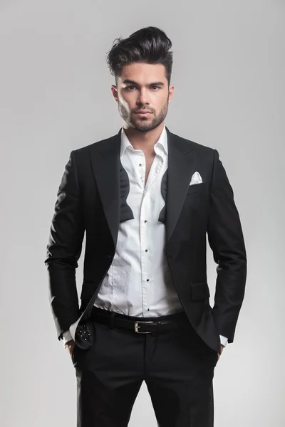 Fashion young man in tuxedo looking at the camera — Stock Photo, Image