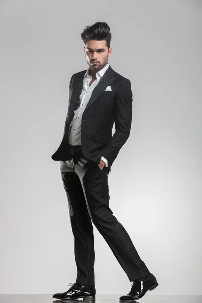 Elegant young man in tuxedo walking — Stock Photo, Image