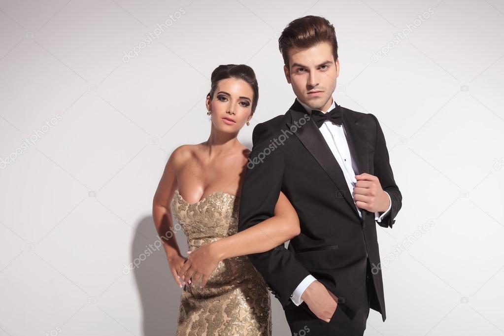 elegant couple holding arms