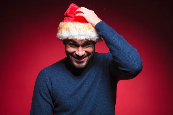 Young santa man scratching his head — Stock Photo, Image