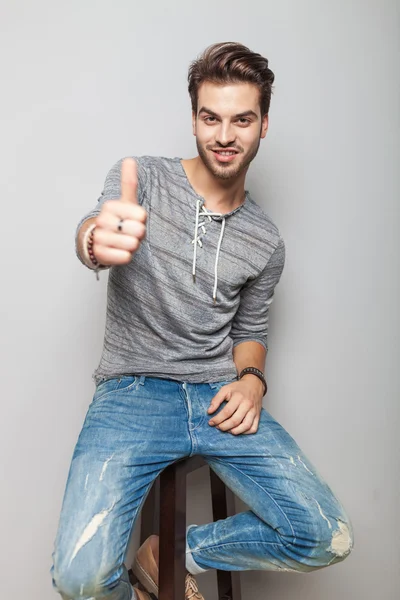 Fashion man showing the thumbs up gesture — Stock Photo, Image