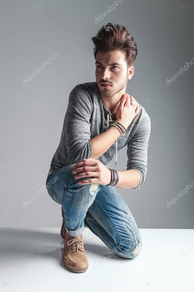 Young fashion man posing for the camera 