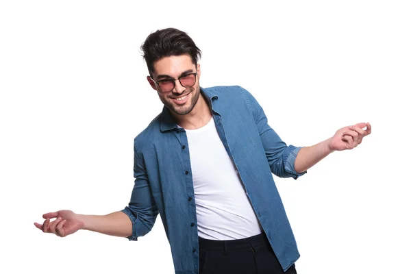 Casual young man welcoming you — Stock Photo, Image