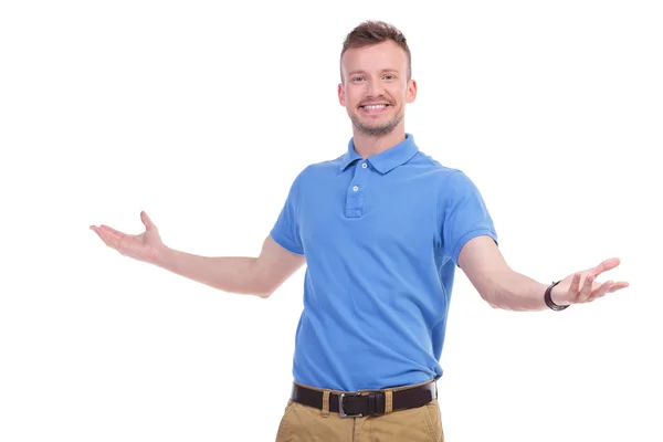 Casual young man welcomes you — Stock Photo, Image