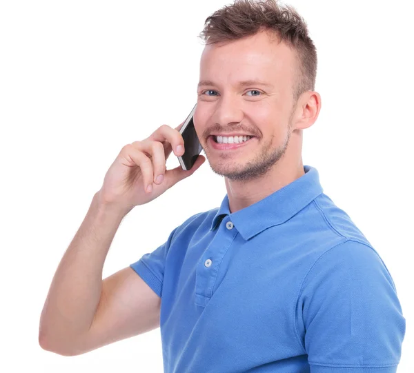 Casual young man calls someone — Stock Photo, Image