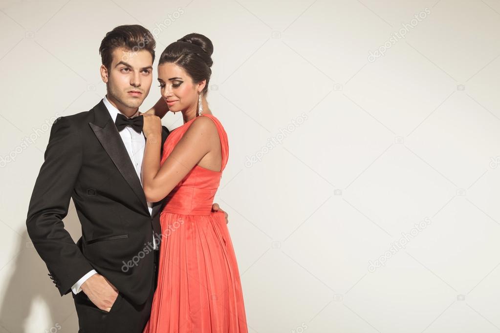 picture of a young elegant couple embracing