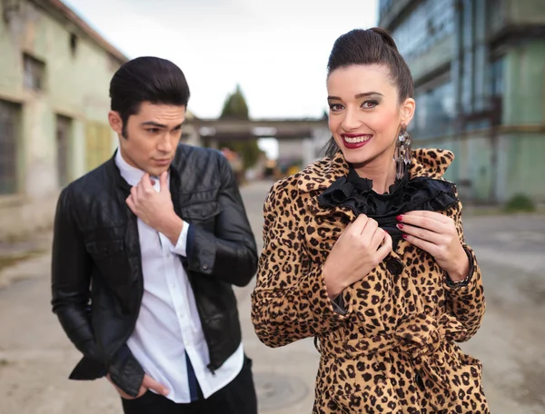 Woman pulling her collar while her lover is looking away — Stock Photo, Image