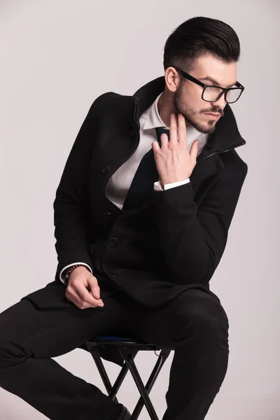 Handsome elegant business man sitting on a stool — Stock Photo, Image