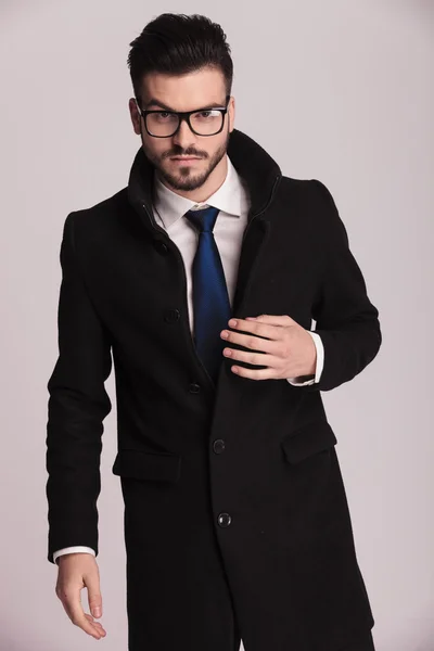 Young business man wearing a long elegant coat — Stock Photo, Image