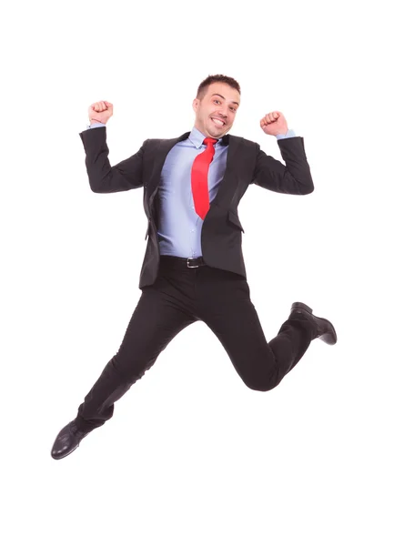 Business man jumping with his hands in the air — Stock Photo, Image