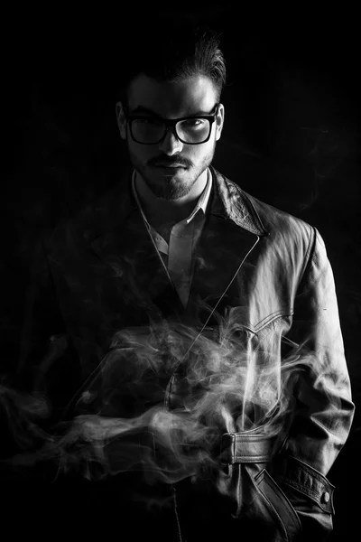 Fashion man posing on dark studio background — Stock Photo, Image