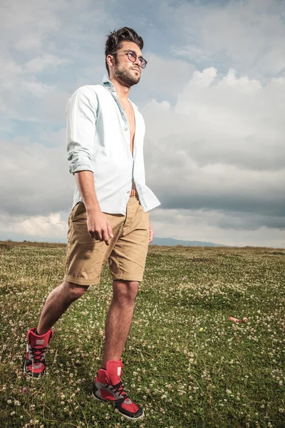 Young man walking outside — Stock Photo, Image