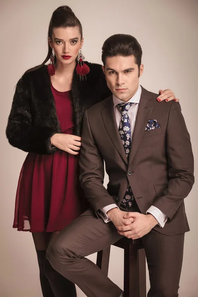 Gorgeous fashion woman standing next to her boyfriend — Stock Photo, Image
