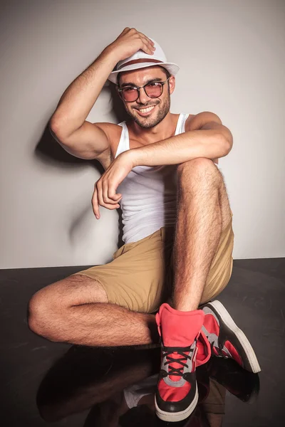 Handsome young casual man resting on the floor — Stock Photo, Image