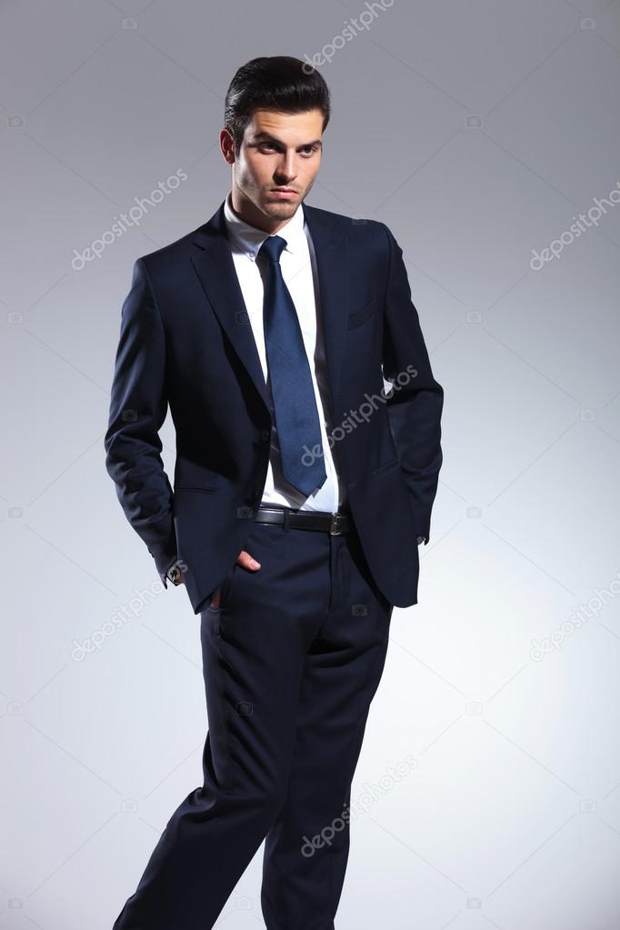 Elegant business man holding his hands in pockets