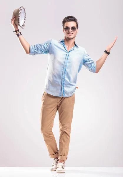 Happy young fashion man welcoming you — Stock Photo, Image