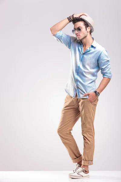 Young casual man posing on studio background — Stock Photo, Image