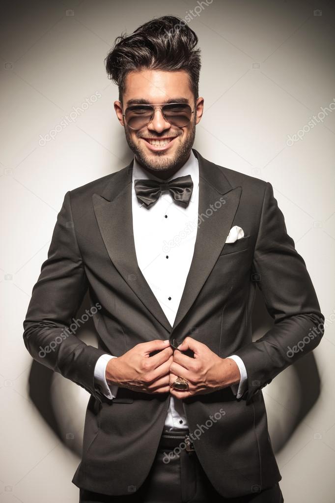 Happy young business man smiling