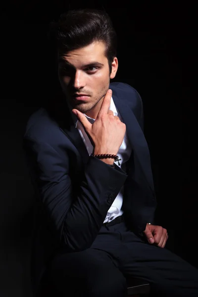 Elegant business man sitting on a chair — Stock Photo, Image