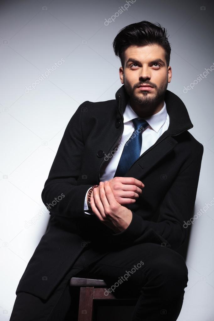 young business man holding his hands together