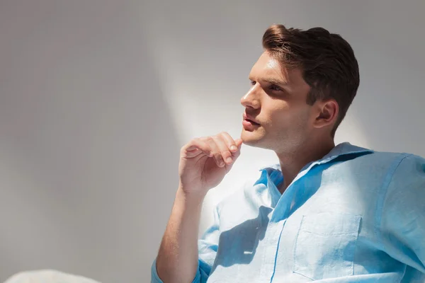 Side view picture of a thinking young casual man — Stock Photo, Image