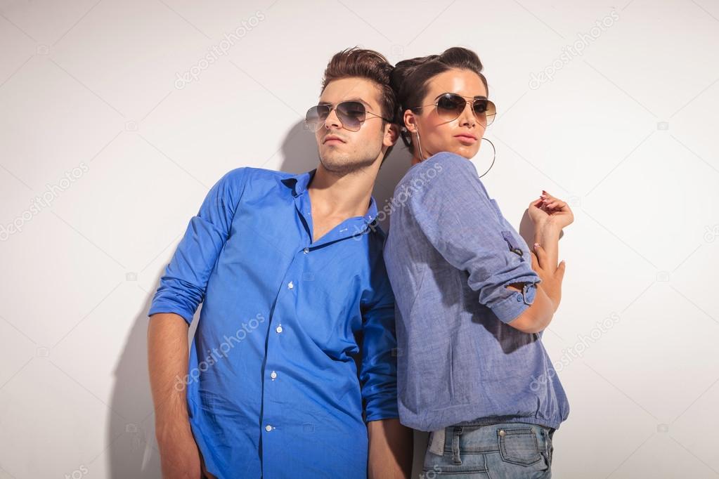 Down view of a casual couple posing together 