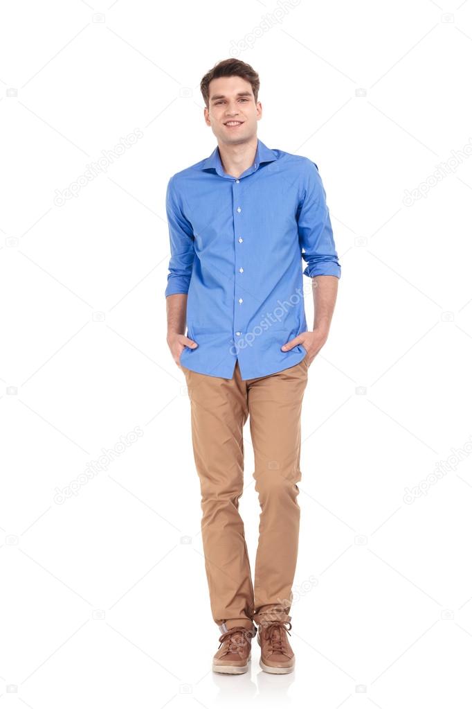 Happy young casual man smiling at the camera