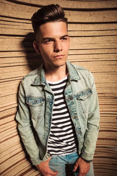 Side view of a casual young man in jeans jacket — Stock Photo, Image