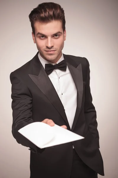 Attractive young business man offering you a invitation. — Stock Photo, Image