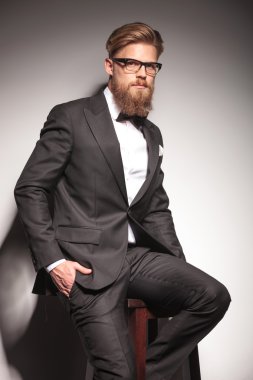 Young blond business man looking at the camera