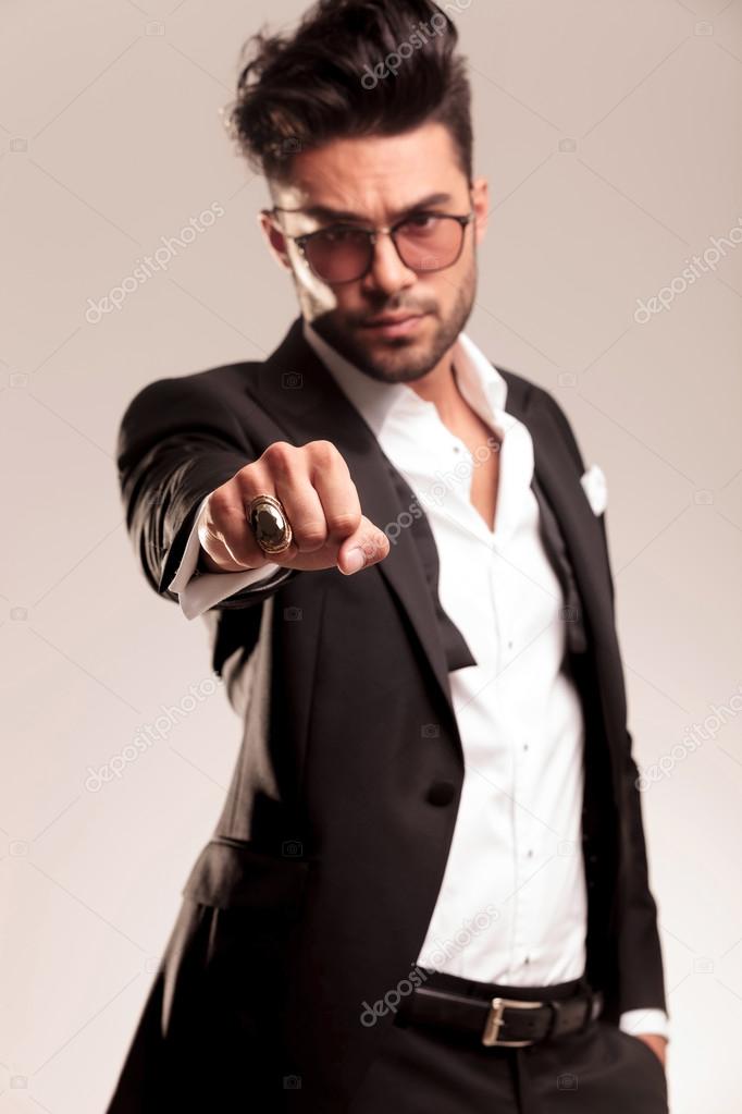 Elegant business man showing his fist