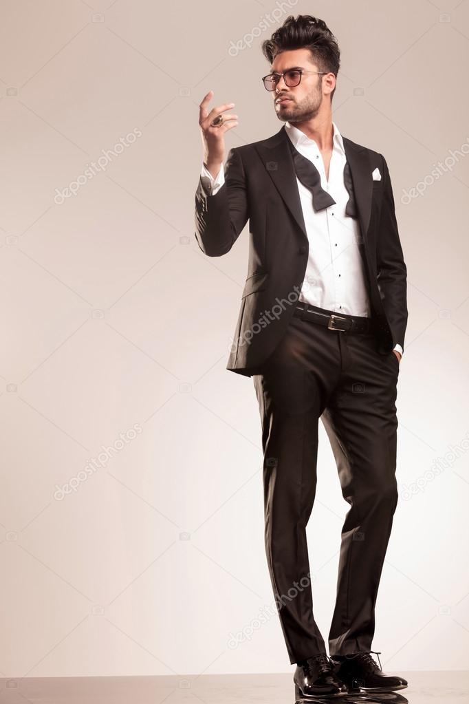 elegant business man holding one hand in his pocket