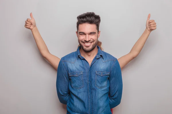 Smiling young man standing with his hand behind — Stock Photo, Image