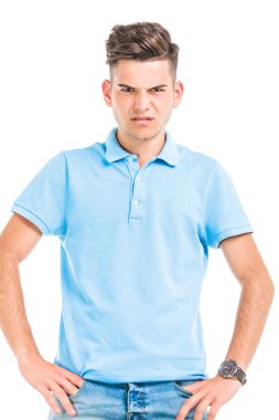 Angry young man looking at the camera