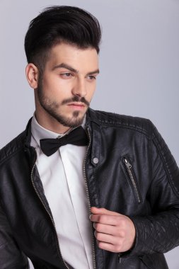 business man holding his hand on the zipper 